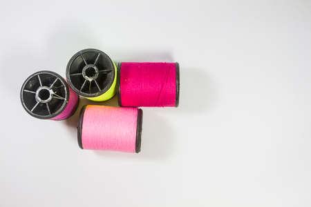 Background white roll of thread colors.