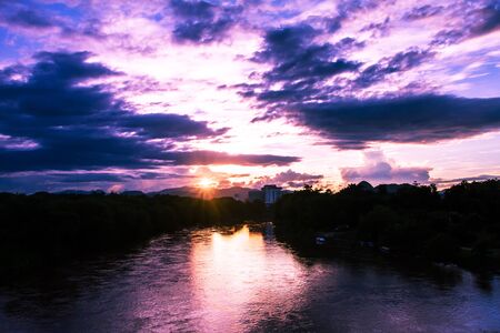 Evening sunsets across the river and sky as the background.の写真素材