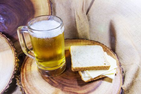 Beer bread with cheese and place the dish on a wooden background.の写真素材