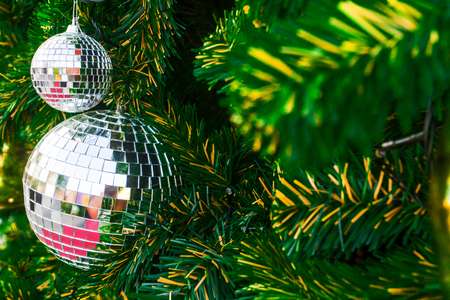 Close up mirror ball decorative Christmas trees as a background.の写真素材