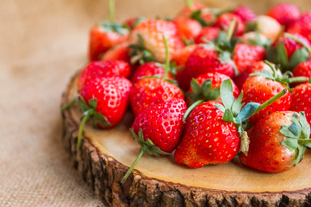 Fresh red strawberries arranged as a background.の写真素材