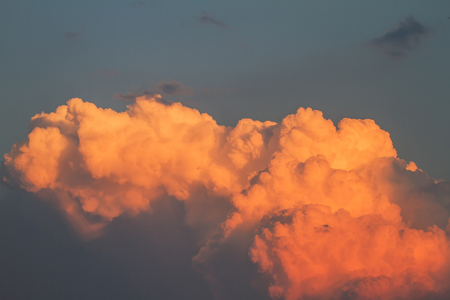 When sunlight clouds orange sunset in the background.