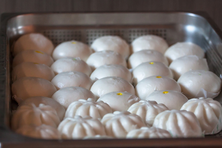 Steamed dumplings in a serving tray.の写真素材