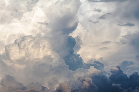 Fluffy white clouds and sky before rain will fall background.の写真素材