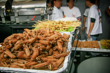 Fried chicken wings were arranged in a tray with a social event.の写真素材