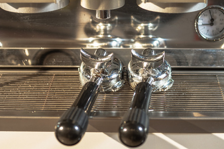 Handle coffee placed on coffee machine. Ready to serve.の写真素材
