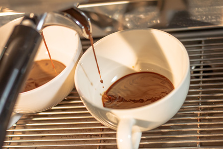 Coffee flows out of the coffee machine Must go through several stages to get the desired coffee flavor.の写真素材