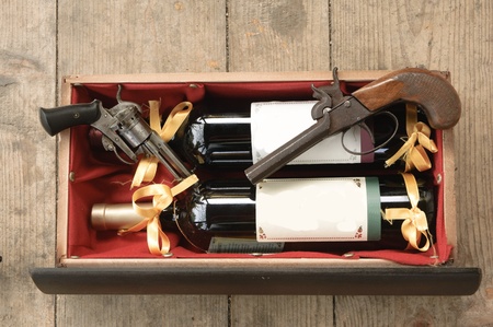 Old gun and wineの写真素材