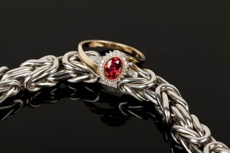 bracelet and ring on black glassの写真素材