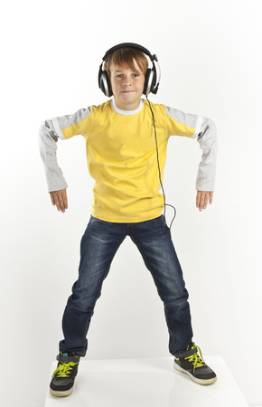 boy with headphones dancing on white backgroundの写真素材