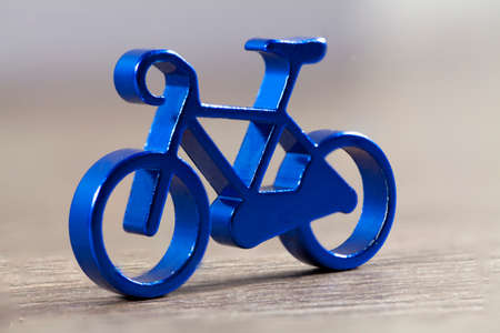 small metallic bicycle pendant close upの写真素材