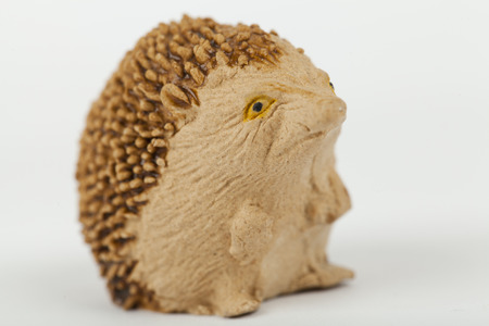 hedgehog  wooden toy solated on whiteの写真素材