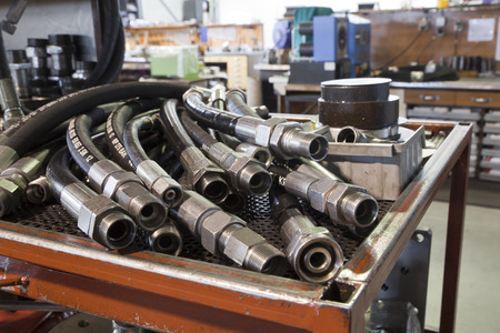 hydraulic hoses on the table in the workshopの写真素材