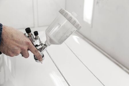 painting with spray gun close upの写真素材