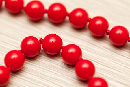 Red pearls background close up