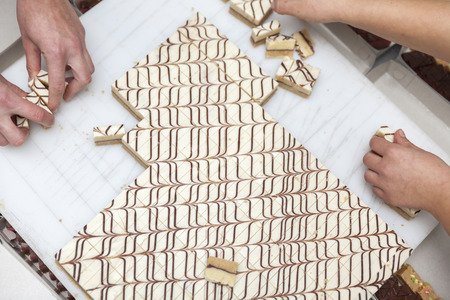 making small cakes in a bakeryの写真素材