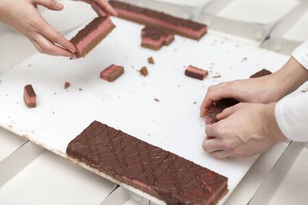 making small cakes in a bakeryの写真素材