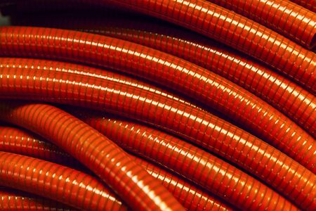 red plastic hoses, abstract background close upの写真素材
