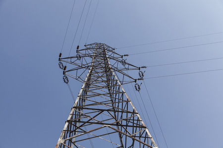 high voltage utility power line and blue sky