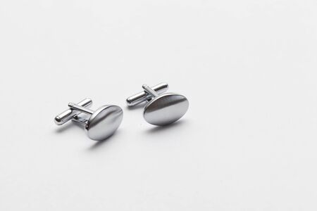 silver cufflinks on white background, close upの写真素材