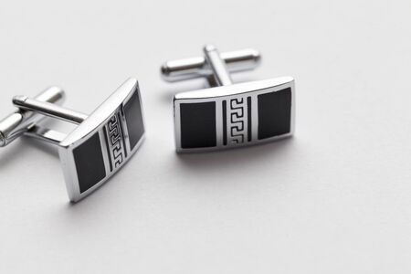 silver cufflinks on white background, close upの写真素材