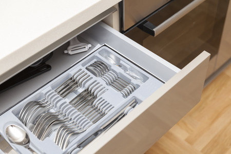 cutlery drawer in kitchen, close upの写真素材