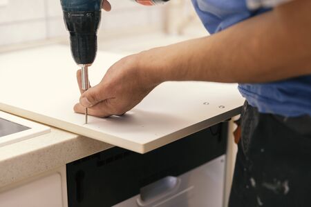 installation of kitchen parts, close upの写真素材