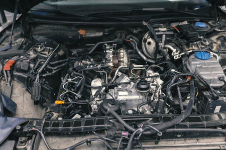 mechanic working on engine repairs, close upの写真素材