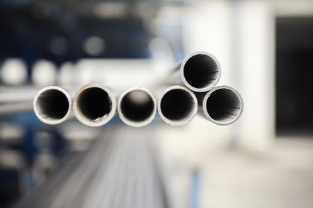 metal inox pipe on stack, close up
