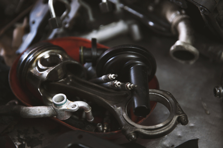 disassembled car engine, on working table