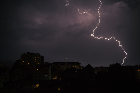 lighting in the dark night ower the cityの写真素材