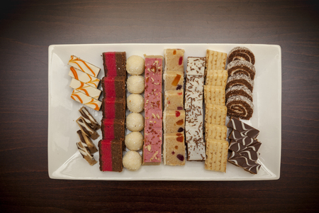 mini cake on white plate, ready to eat