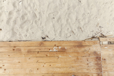wooden floor and beach sand, look on topの写真素材