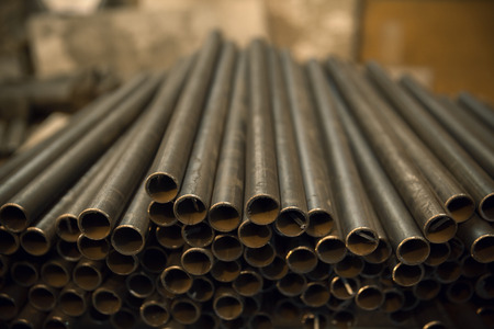 metal pipes stored for work in work shop