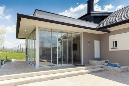 glazed terrace in the countryside with sliding glassの写真素材