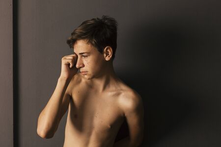 portrait of young boy with acne problems, puberty teenage