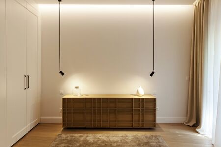 wooden dresser with lamps in the bedroom, empty spaceの写真素材