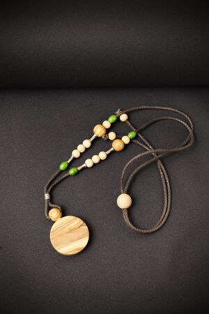 handmade necklaces on a black background, close upの写真素材