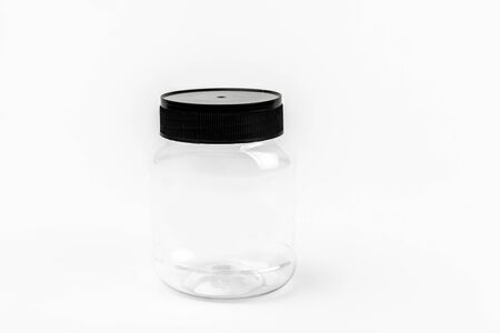 empty transparent plastic jar on white backgroundの写真素材