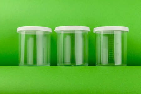 medical transparent plastic container with white lid, close upの写真素材