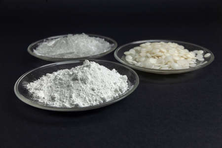 raw materials for the cosmetics industry, mint crystal, wax, powder on black backgroundの写真素材