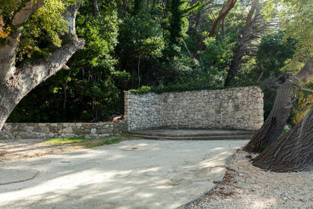 a stone wall in the woods, mini stageの写真素材