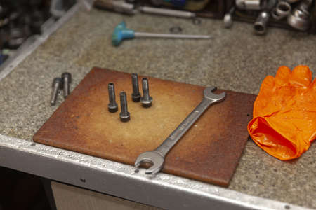 metal works table with wrench and boltsの写真素材