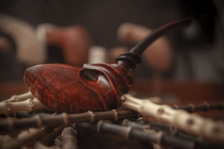 vintage smoking pipe on the leather background, close upの写真素材