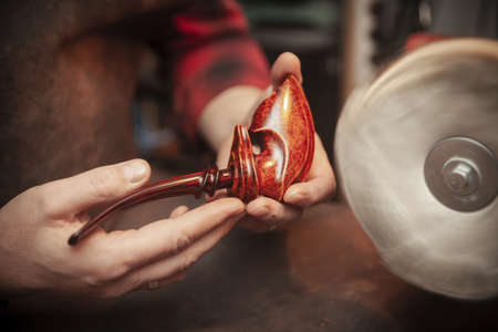 vintage smoking pipe on the leather background, close upの写真素材