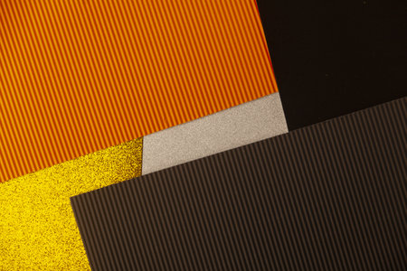 abstract background, mixed colors, orange, brown, gold, black, silver, copy space, close up