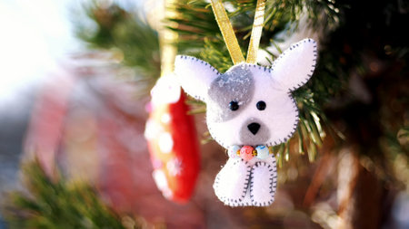 close-up, Christmas toys hanging on a snow-covered tree branch. winter, frosty, snowy, sunny day. High quality photoの写真素材