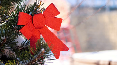 close-up, Christmas toys hanging on a snow-covered Christmas tree branch. winter, frosty, snowy, sunny day. High quality photoの写真素材