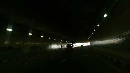 DUBAI, UNITED ARAB EMIRATES, UAE - NOVEMBER 20, 2017: Road and tunnel on the Palm Jumeirah island in Dubai, Car driving on to tunnel.View from car on traffic in tunnel. High quality photoのeditorial素材