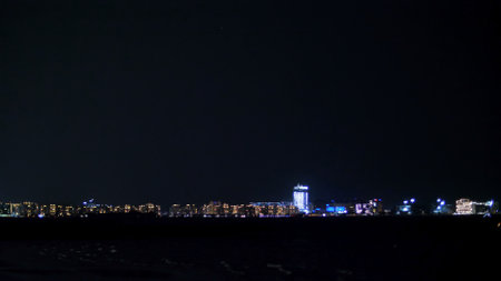 DUBAI, UNITED ARAB EMIRATES, UAE - NOVEMBER 20, 2017: at night, far away, you can see the lights of the city, skyscrapers,. High quality photoのeditorial素材